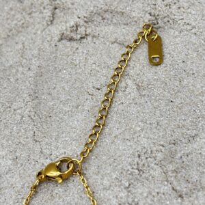 Goudkleurig enkelbandje met bolletjes