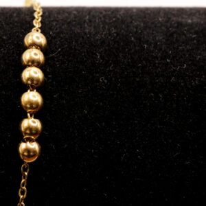 Goudkleurig enkelbandje met bolletjes